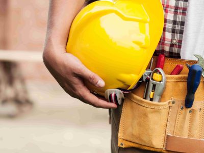 close-up-hard-hat-holding-by-construction-worker (1)